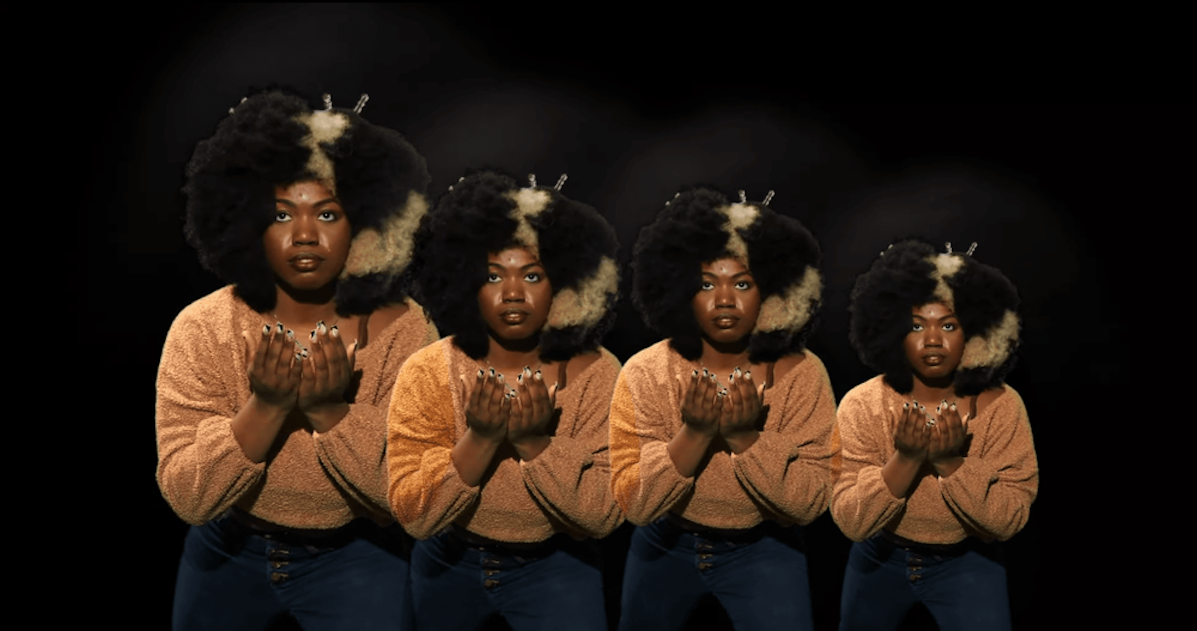 film still showing an african-american person praying repeated in four different sizes, over a black background